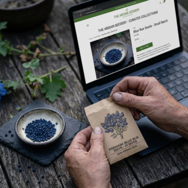 Fresh dark blue poppy seeds beside a clearly labeled premium seed packet.