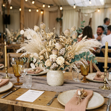 Wedding centerpiece using dried Austrian poppy pods UK in a boho arrangement.