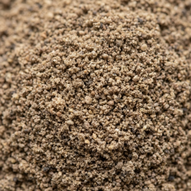 Fine-ground dried poppy pod powder displaying uniform particle size and consistent muted color