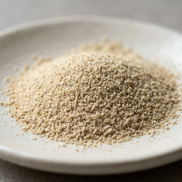 Fine-ground dried poppy pod powder showing uniform particle size and consistent muted color.