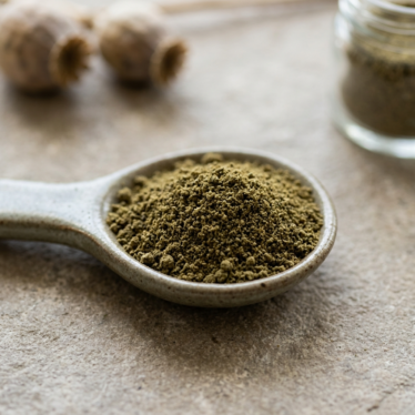 Close-up of premium dried poppy pod powder with even color and fine texture.